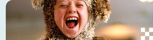 photo of a boy wearing a bear costume